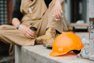 Safety helmet at the construction site. The concept of safety at work.