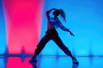 Fotobehang A woman dancing in a white shirt and black pants © Alena