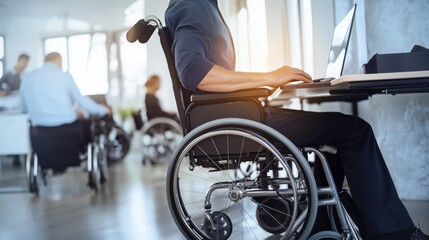 Obraz premium Person in a Wheelchair Working at a Desk in a Modern Office Environment