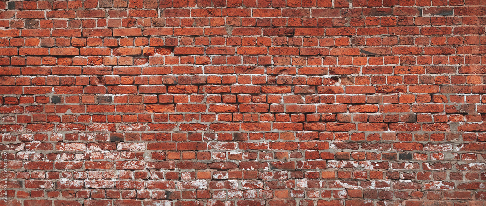 Poster a brick wall with a red color. the wall is made of bricks and has a rough texture