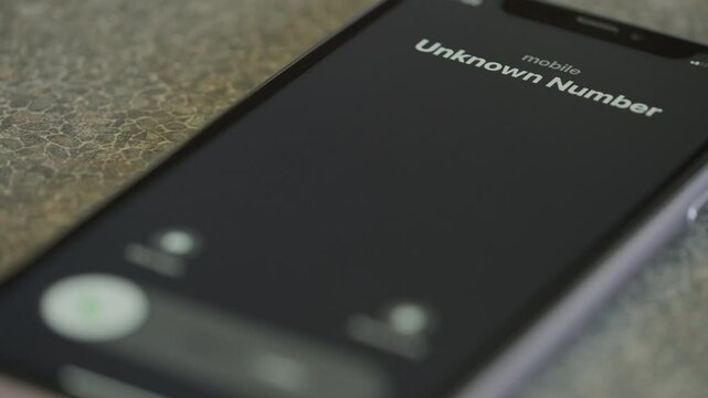 Incoming call from unknown number on  smartphone macro video.