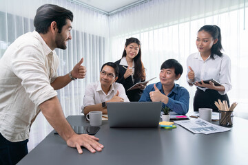 Obraz premium Excited and happy office worker employee celebrate after make successful strategic business marketing planning. Teamwork and positive attitude create productive and supportive workplace. Prudent