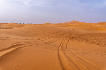 Off-Road Vehicle Silhouette on Erg Chebbi Dunes at Sunrise