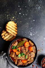 Goulash (meat stew with tomatoes and paprika) - traditional dish of hungarian cuisine.