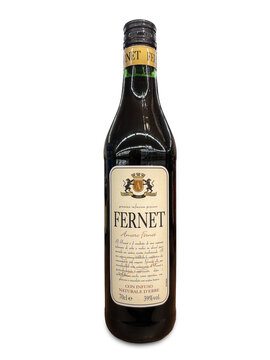 Italy - September 12, 2024: Fernet bottle isolated on white, typical Italian digestive liqueur infused with herbs and roots in alcohol .