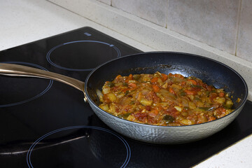 Vegetable stew, cooking in a pan. Spanish food concept.