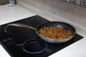 Vegetable stew, cooking in a pan. Spanish food concept.