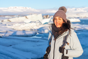 Portrait of a woman on the frozen iceberg lake of Jokursarlon. Iceland