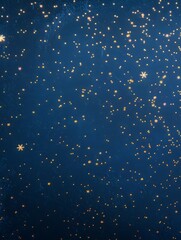dark blue background with small gold particles. place for creative text