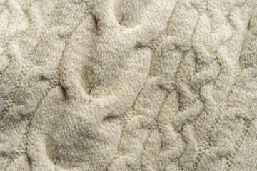 Handmade white knitted wool blanket. Background textures