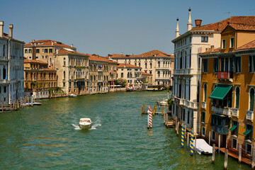 Venice and its buildings,canals,gondolas,and sculptures