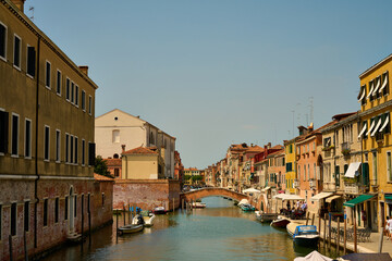 Venice and its buildings,canals,gondolas,and sculptures