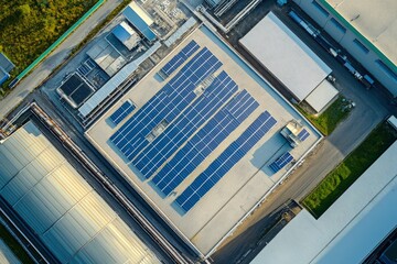 Solar energy for factory and warehouse building. Solar panels on roof of industrial plant. Commercial solar power. Rooftop solar power. Rooftop renewable energy system. Sustainable green energy, ai