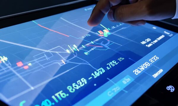 Stock market or forex trading graph on touchscreen, finance and investment concept. Economy trends for business, financial charts and digits