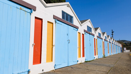 Scenic view of waterfront boat sheds of harbour marina in capital city of Wellington, New Zealand Aotearoa