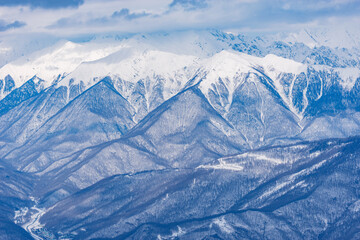 Fototapeta premium Winter mountain ski resort at sunset.