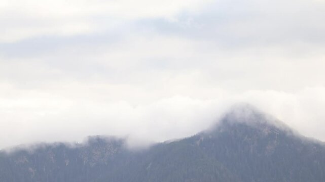 Mountain Peak Behind Misty Clouds