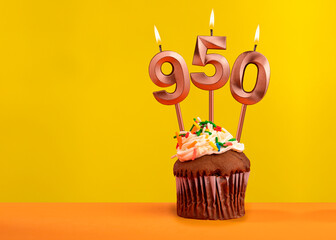 Candle with flame number 950 - Anniversary card on yellow background