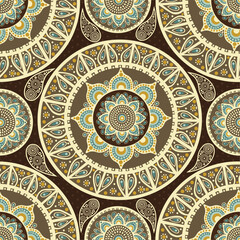A decorative pattern featuring intricate mandala designs in earthy tones and soft colors, suitable for textiles or wallpaper.