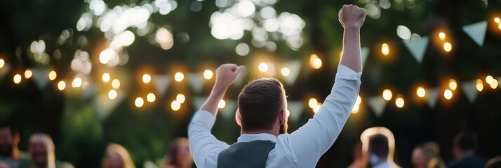 A festive celebration taking place at night, illuminated by decorative lights, capturing the joyous atmosphere of mingling guests and the energy of an outdoor evening event.