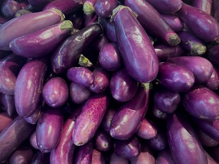 Top view of a group of purple eggplant sale at the groceries market in Malaysia.