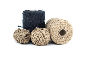 Collection of jute and twine spools on a white background, highlighting natural fiber materials