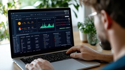 Professional analysis of data on a laptop screen, showcasing graphs and statistics in a modern workspace.