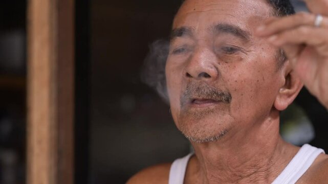 Old Man Smoking