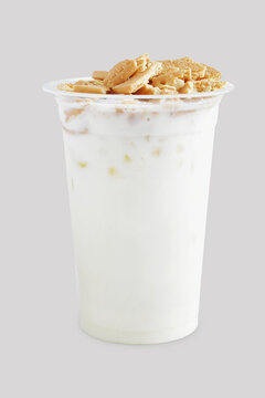 A Cup of milk iced drink with regal biscuit