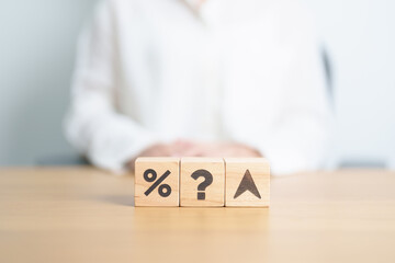 Naklejka premium wood block of Question mark with percentage change to UP and Down arrow. Interest rate, GDP, stocks market, financial, deflation and Inflation, ranking, mortgage, debt, Loan and Economic Recession