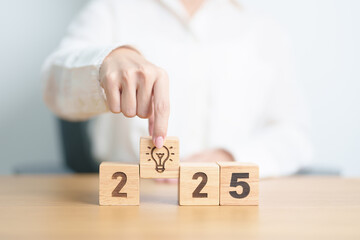 2025 block with lightbulb. Business Idea, Creative, Thinking, brainstorm, Goal, Resolution,...
