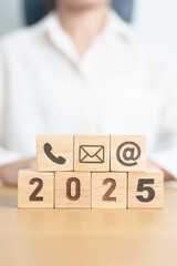 Happy New Year 2025 block for Contact Us concepts. Wood block of Email, call Phone and Website...