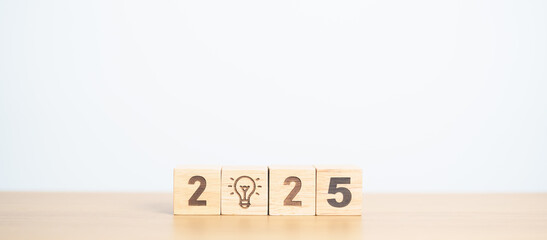 2025 block with lightbulb. Business Idea, Creative, Thinking, brainstorm, Goal, Resolution, strategy, plan, Action, change and New Year start concepts