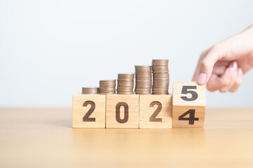 2024 end year to Happy New Year 2025 with Coins stack. Money, Budget, tax, investment, financial,...