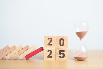 wood block falling to 2025 year with hour glass or sandglass. risk management, financial, deflation...