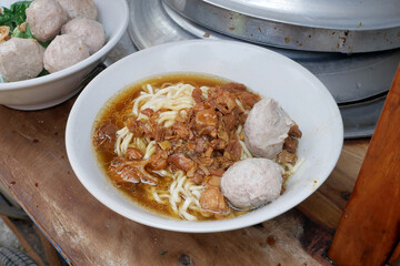 chicken noodle meatball or mie ayam bakso. popular street food in Indonesia, in the cart, good for article or recipe