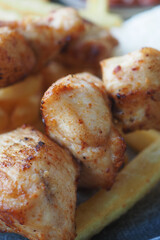 Chicken skewers with french fries and rice 