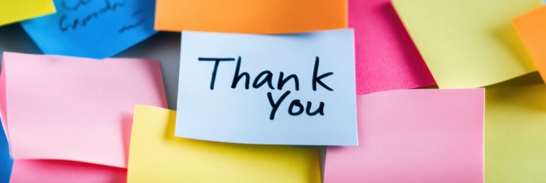A 'Thank You' note prominently displayed on a colorful sticky notes background, conveying appreciation and gratitude. Each sticky note represents a thoughtful gesture.