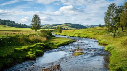 Fototapeta premium A farm landscape with a river running through it.