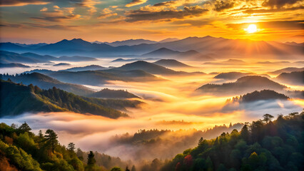 Obraz premium Golden Sunrise Over Misty Mountainscape 