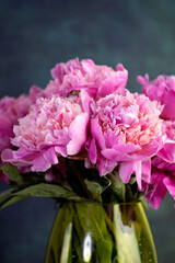 Vibrant Pink Peonies in a Green Vase