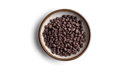 Obraz premium Top view of roasted coffee beans in a bowl on white background