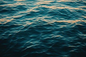 Obraz premium Water background texture. Sea surface in sunset light. Breezy wavy seawater. Sea water texture. Teal blue ocean view. Fresh water of lake. Relaxing natural photo wallpaper. Still water surface, ai