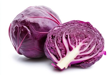 Obraz premium A whole red cabbage and a sliced half are arranged on a white background, showcasing their vibrant purple hue and intricate texture. They are ready to be used in delicious dishes, salads, or as a heal