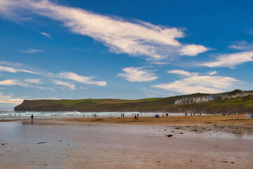 Scenic Beach with People and Hills in Cornwall, UK
