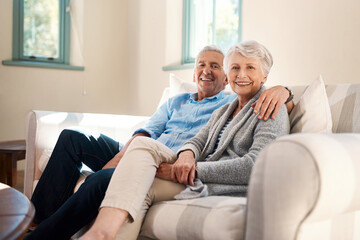 Happy, portrait and senior couple on sofa for connection, bonding and relaxing together at home. Smile, love and elderly man and woman hugging for resting in living room at house in Switzerland.