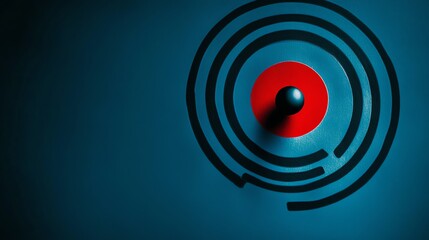 A black ball sits in the center of a red target.