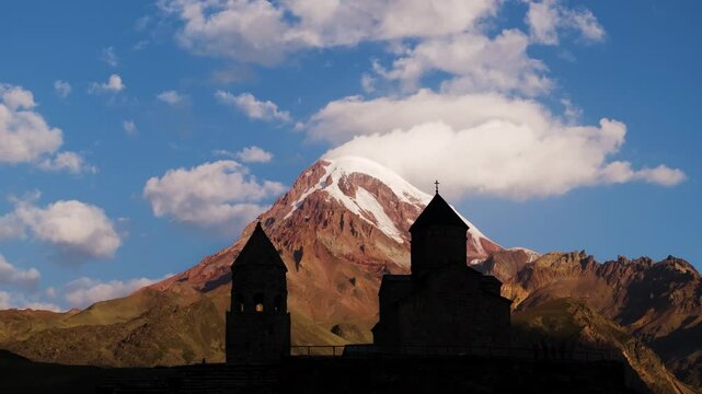 Amazing Aerial View Above Gergeti Trinity Church, Georgia. Mount Kazbek. Summer Sunrise