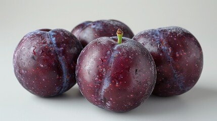 Obraz premium Fresh Plums on White Background - Isolated Fruits for Healthy Snacks and Desserts