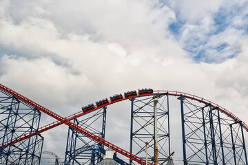 Thrilling Roller Coaster Ride Against Cloudy Sky in Blackpool, UK